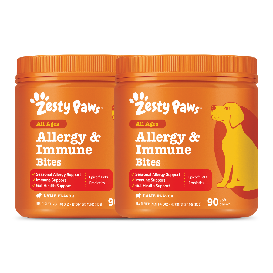 Two orange Zesty Paws Allergy & Immune Bites containers with lamb flavor and yellow dog illustration on right jar.