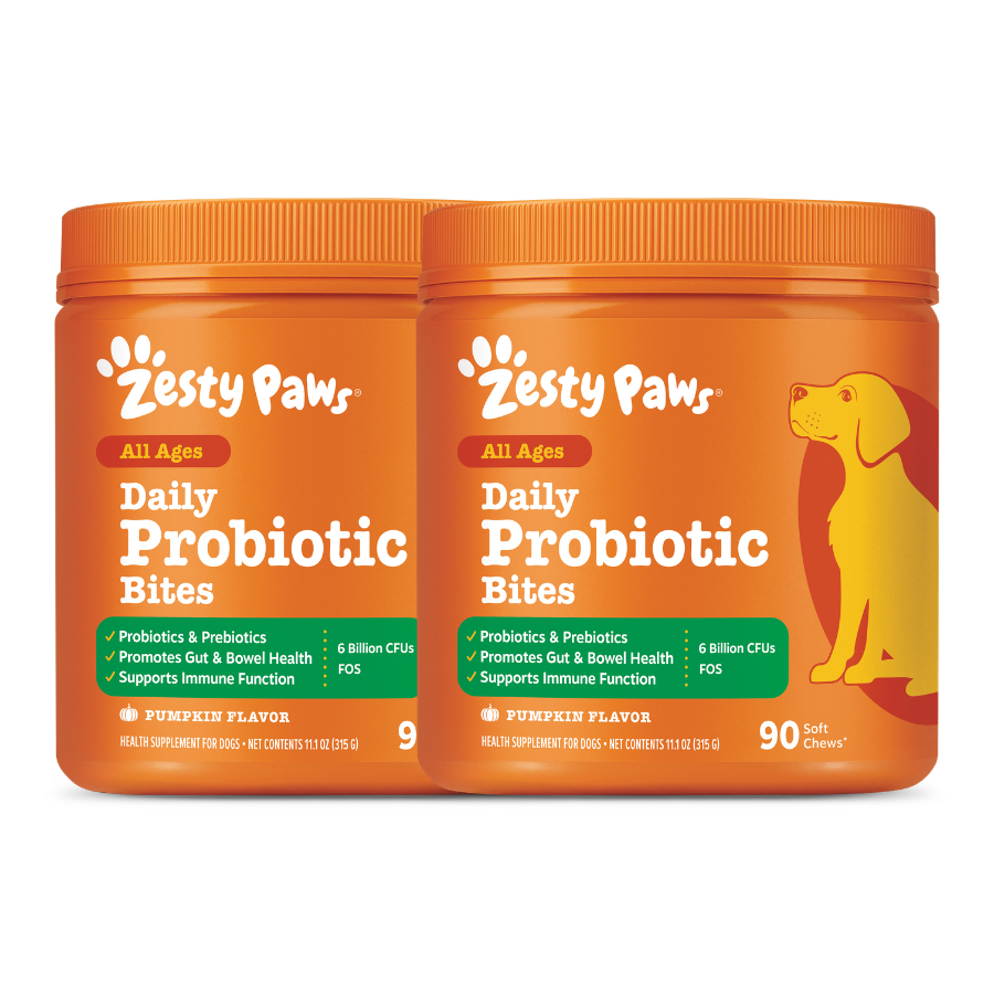 Two orange Zesty Paws Daily Probiotic Bites containers with pumpkin flavor and yellow dog illustration on label.
