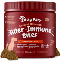 Red jar of Zesty Paws Ancient Elements Aller-Immune Bites soft chews for dogs with brown treats displayed in front.