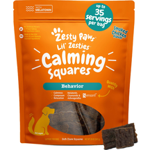 Orange bag of Zesty Paw Lil' Zesties Calming Squares with smoked chicken flavor, displaying brown soft chew squares and produ
