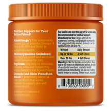 Orange jar of Hairball Bites cat treats with ridged cap, ingredient information on label, and dosage chart.