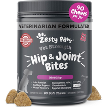 Dark gray jar of Zesty Paw Vet Strength Hip & Joint Bites with pink accents and soft chew treats displayed in front.