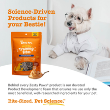 Orange Zesty Paws training bites pouch next to a white dog wearing glasses and shirt reading a book.