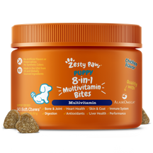 Orange bottle of Zesty Paw puppy multivitamin soft chews with brown bite-sized pieces displayed in front.