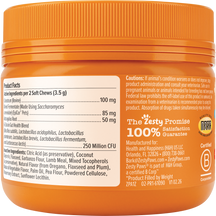 Orange jar of puppy soft chew supplements with product facts and cautions label visible on front.