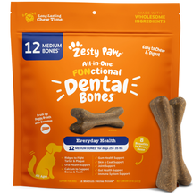 Brown dental chew bones for medium dogs displayed next to orange packaging labeled "Zesty Paws All-in-One Functional Dental B