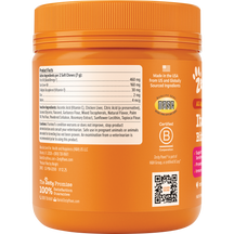 Orange jar of dog chew treats with ridged lid, product facts label, and made in USA certification visible.