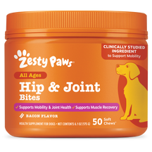 Orange plastic container of Zesty Paws Hip & Joint Bites for dogs with yellow dog illustration and bacon flavor label.