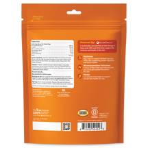 Orange resealable pouch of cat hairball mousse with product facts, ingredients, and nutritional information printed on back.