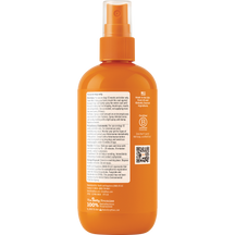 Orange spray bottle with pump nozzle and ribbed collar containing flea and tick treatment liquid.