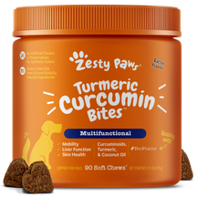 Orange jar of Zesty Paw Turmeric Curcumin Bites dog supplements with brown soft chews displayed in front.