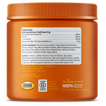 Orange jar with ridged cap containing turmeric curcumin soft chews for dogs, displaying product facts label and certification