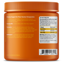 Orange jar with ridged lid containing turmeric curcumin dog chews, labeled with ingredient information and dosage instruction