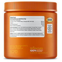 Orange jar with ribbed lid containing soft chew dog treats, displaying product facts label and B Corporation certification ba