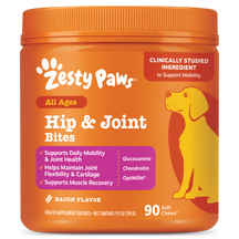 Orange jar of Zesty Paws Hip & Joint Bites dog supplement with yellow dog illustration and purple ingredient list panel.