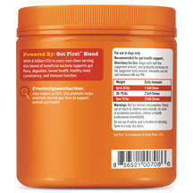 Orange plastic container of probiotic dog chews with red and white label containing usage and ingredient information.