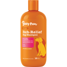 Orange plastic bottle of Zesty Paws Itch-Relief Dog Shampoo with white text, pink panel, and yellow dog illustration, 16 fl o