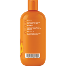 Orange dog shampoo bottle with orange cap and ingredient information on label.