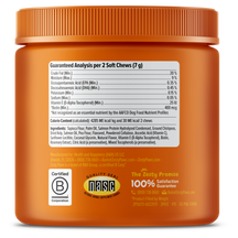 Orange plastic jar with ribbed cap containing dog soft chews, displaying nutritional information and ingredient labels on fro
