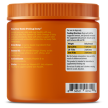 Orange jar with orange ribbed lid containing dog soft chews, with ingredient and feeding information labels on front.