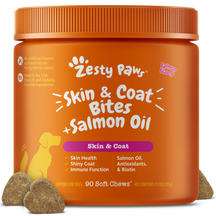 Orange bottle of Zesty Paws Skin & Coat Bites with salmon oil soft chews for dogs, featuring a paw logo and product informati
