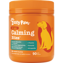 Orange plastic jar of Zesty Paws Calming Bites dog treats with yellow and red dog illustration and orange screw-top lid.