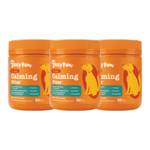 Three orange Zesty Paws Calming Bites containers with yellow dog silhouettes and teal labels, each containing 90 chews.