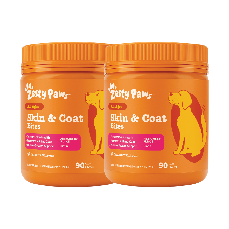 Two orange Zesty Paw Skin & Coat Bites containers with dog illustration and orange screw-on lids.