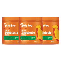 Three orange Zesty Paws Daily Probiotic Bites jars with pumpkin flavor for all ages dogs.