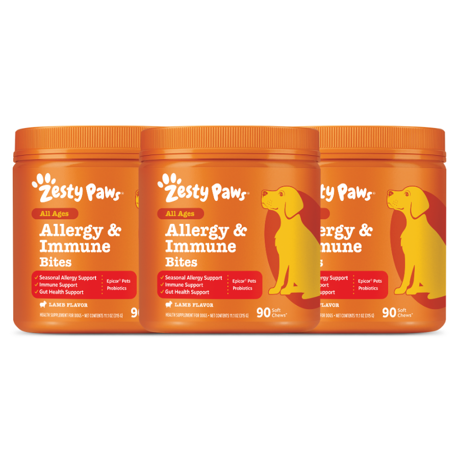 Three orange jars of Zesty Paw Allergy & Immune Bites with yellow dog silhouettes and lamb flavor labels.