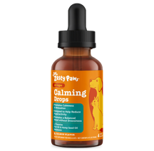 Brown glass bottle with black dropper top labeled "Zesty Paws Calming Drops" featuring orange and yellow packaging with dog a