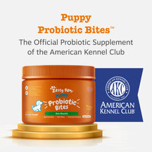 Orange jar of Puppy Probiotic Bites with green label and orange ribbed lid on gold pedestal next to AKC badge.