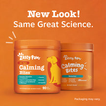 Two orange containers of Zesty Paws Calming Bites dog treats with yellow dog illustration and product information on orange b
