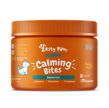 Orange jar of Zesty Paw Puppy Calming Bites with orange ridged cap and white paw logo.