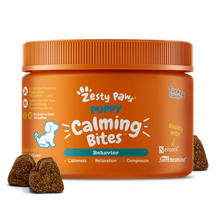 Orange jar of Zesty Paw puppy calming bites with brown textured treats displayed in front.