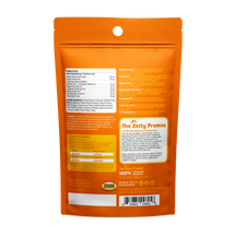 Orange pouch of dog calming bites with ingredient list, dosage chart, and product information on back label.
